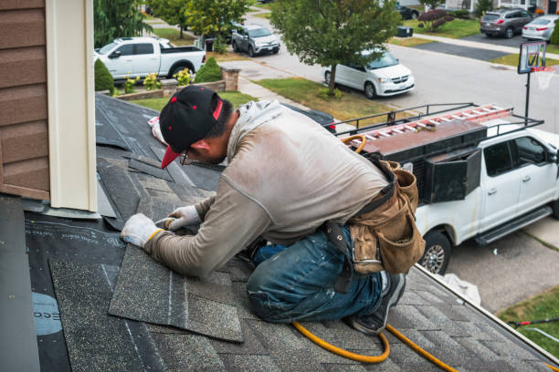 Professional Roofing technician working in Chester, WV